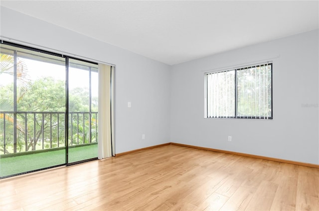 spare room featuring light hardwood / wood-style floors