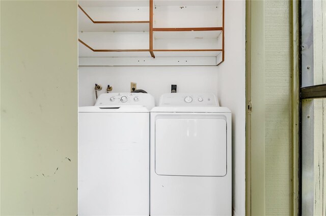 laundry area with washing machine and clothes dryer