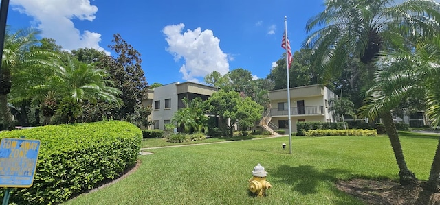 view of home's community featuring a lawn