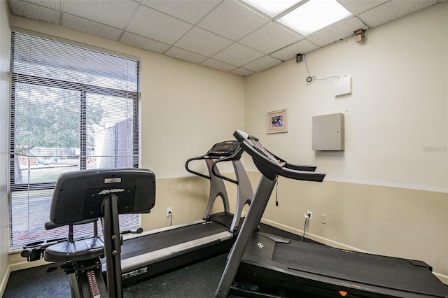 exercise room with a drop ceiling