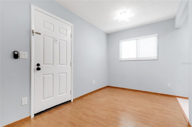 unfurnished room featuring light wood-type flooring