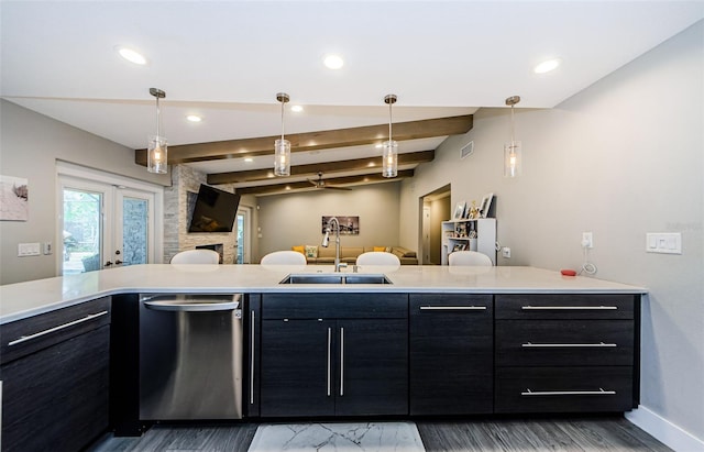 kitchen with hanging light fixtures, sink, stainless steel dishwasher, wood-type flooring, and vaulted ceiling with beams