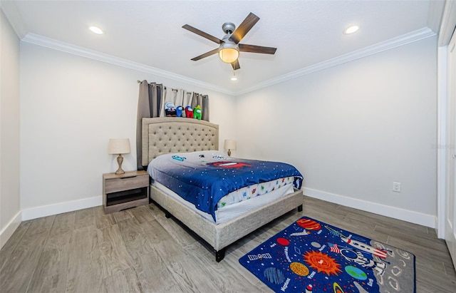 bedroom featuring crown molding, ceiling fan, and light wood-type flooring