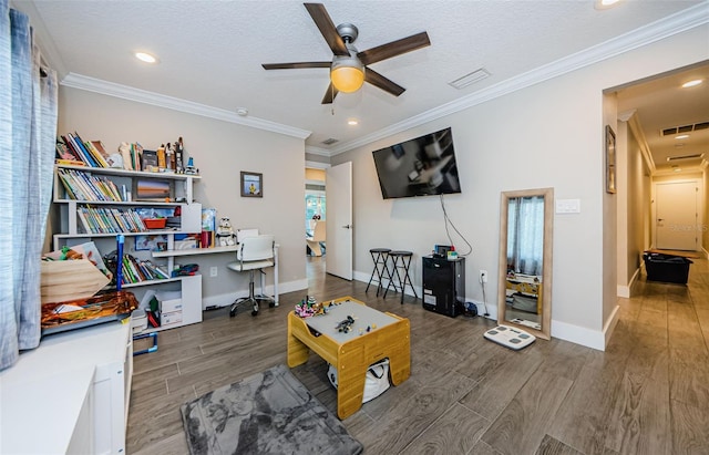 interior space with ornamental molding, ceiling fan, dark hardwood / wood-style floors, and a textured ceiling