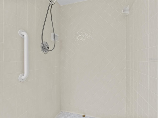 bathroom with tiled shower