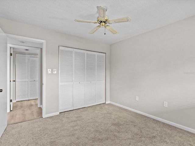 unfurnished bedroom featuring a closet, carpet flooring, and baseboards