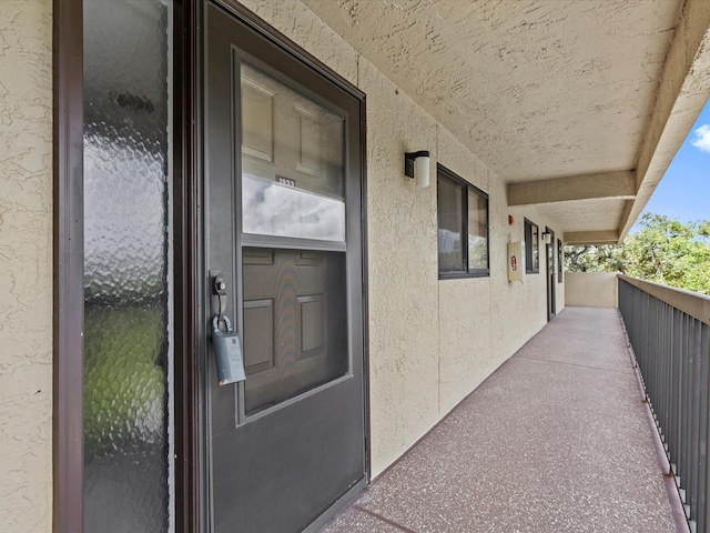 doorway to property with stucco siding