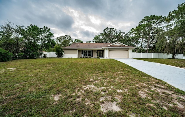 single story home featuring a garage and a front lawn