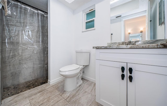 bathroom with tile patterned flooring, vanity, toilet, and a shower with shower curtain