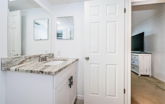 bathroom with vanity and a textured ceiling