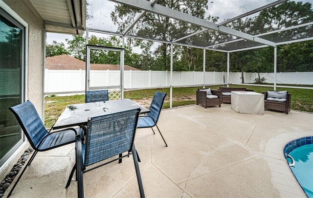 view of patio / terrace with a fenced in pool, a lanai, and an outdoor hangout area