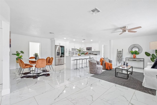 living room featuring ceiling fan