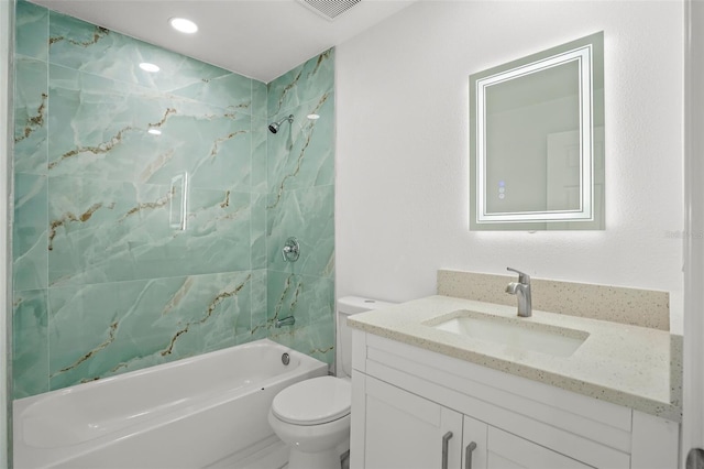 full bathroom featuring vanity, tiled shower / bath combo, and toilet