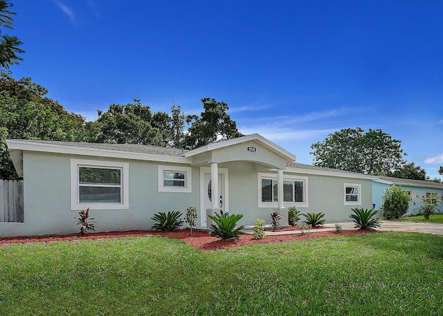 single story home with a front yard