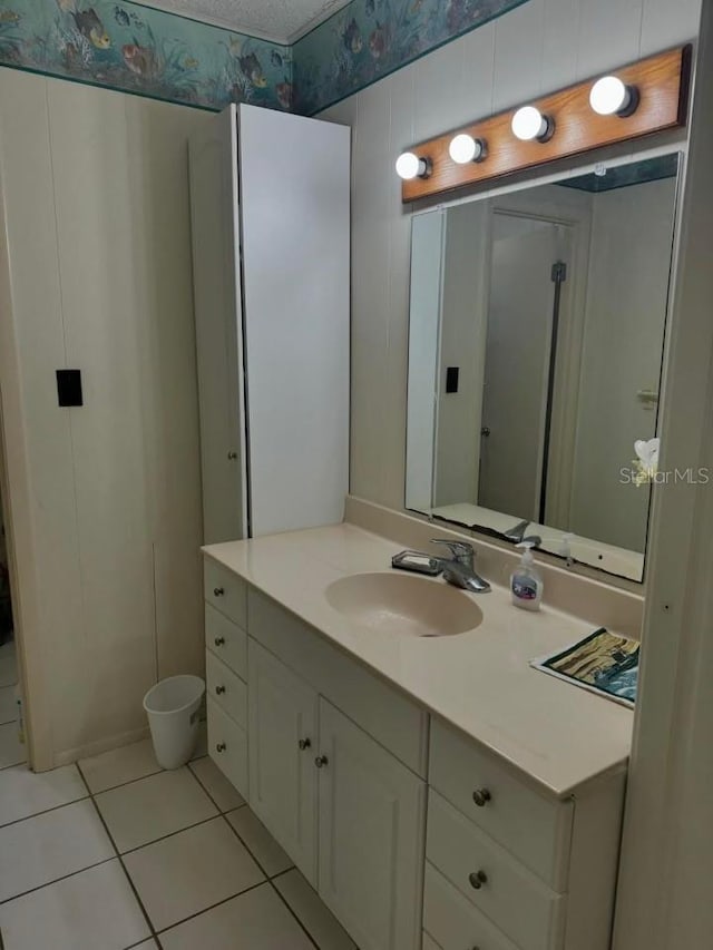 bathroom with vanity and tile patterned floors