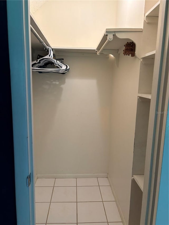 walk in closet featuring light tile patterned floors