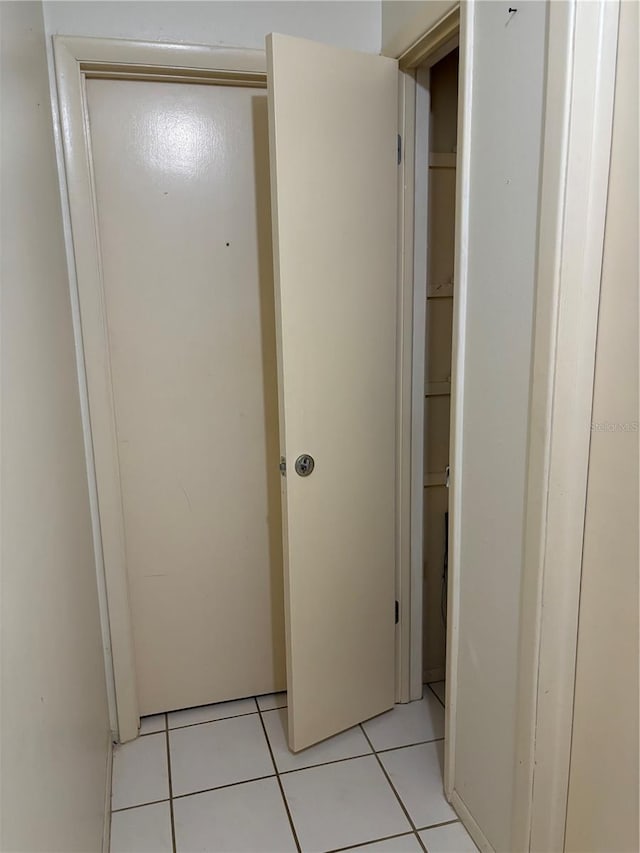 hallway featuring light tile patterned floors