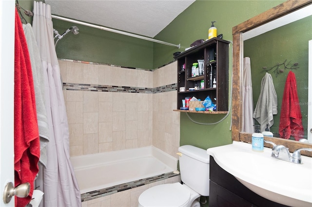 full bathroom with vanity, toilet, a textured ceiling, and shower / bath combo