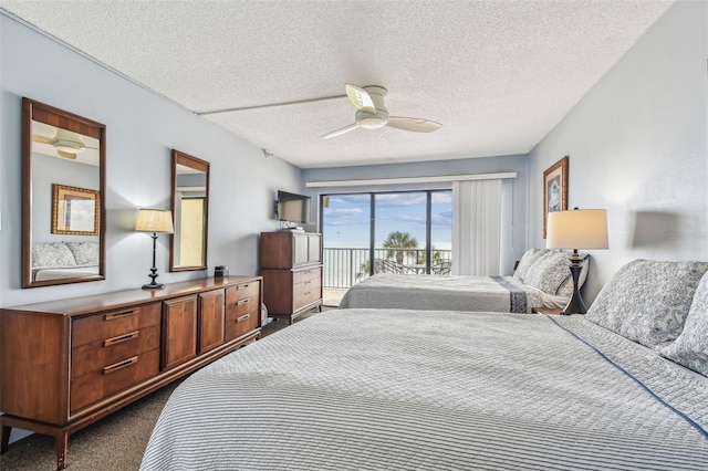 14950 Gulf Blvd Unit 404, Madeira Beach, FL 33708 - bedroom with access to outside, dark colored carpet, and a textured ceiling