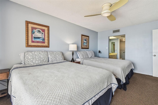 14950 Gulf Blvd Unit 404, Madeira Beach, FL 33708 - bedroom with carpet flooring, a textured ceiling, a ceiling fan, and connected bathroom