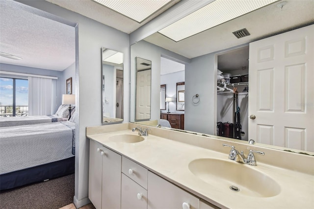 14950 Gulf Blvd Unit 404, Madeira Beach, FL 33708 - ensuite bathroom with double vanity and a spacious closet