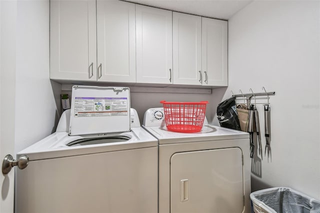 14950 Gulf Blvd Unit 404, Madeira Beach, FL 33708 - laundry area with cabinet space and washer and clothes dryer