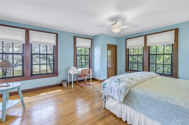 bedroom featuring light hardwood / wood-style flooring and ceiling fan