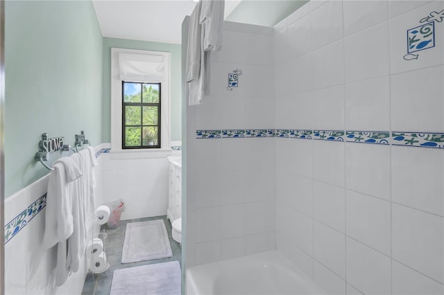 full bathroom featuring vanity, shower with separate bathtub, tile walls, toilet, and tile patterned floors