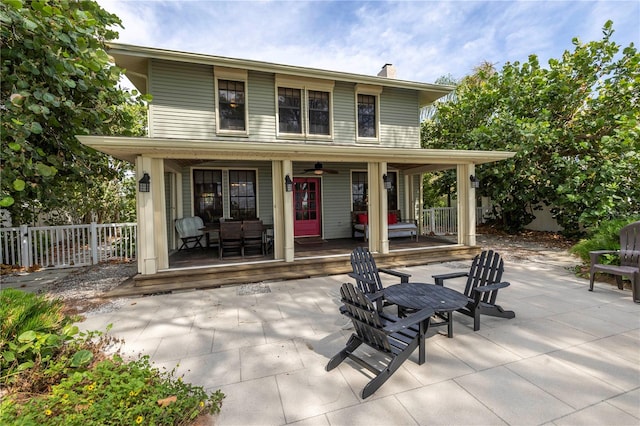 rear view of property with a porch