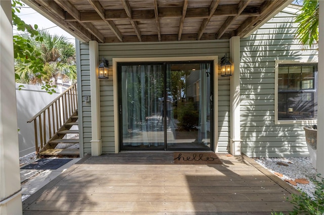 property entrance featuring a wooden deck