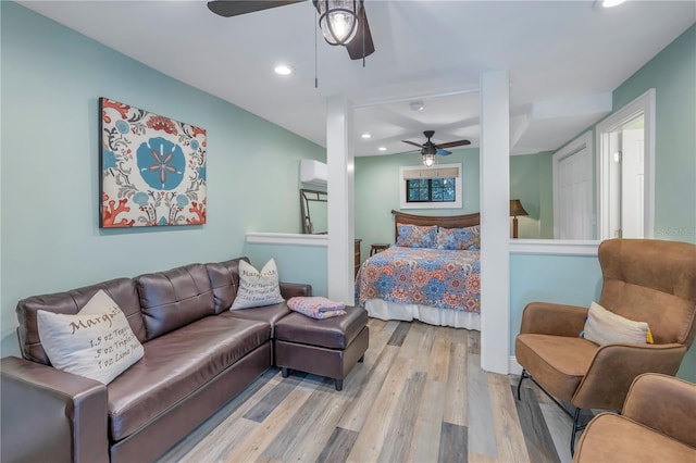 bedroom featuring light hardwood / wood-style flooring and ceiling fan