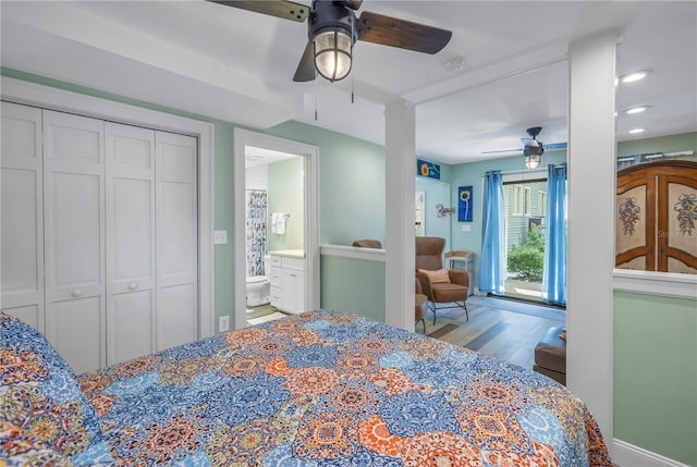 bedroom with ceiling fan, a closet, ensuite bathroom, and hardwood / wood-style flooring