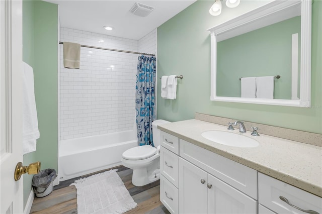 full bathroom with vanity, toilet, shower / tub combo, and wood-type flooring