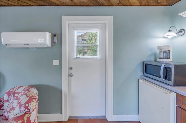 entryway with a wall mounted AC and wooden ceiling