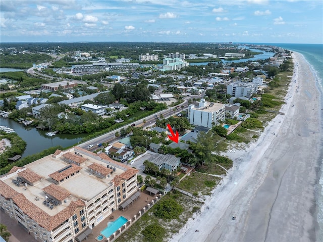 bird's eye view featuring a view of the beach and a water view