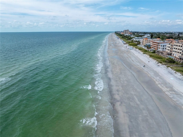 drone / aerial view featuring a view of the beach and a water view