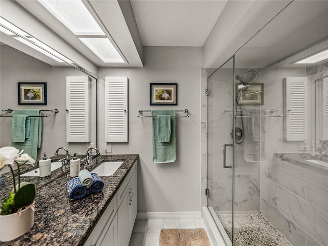 bathroom with tile patterned floors, an enclosed shower, and vanity