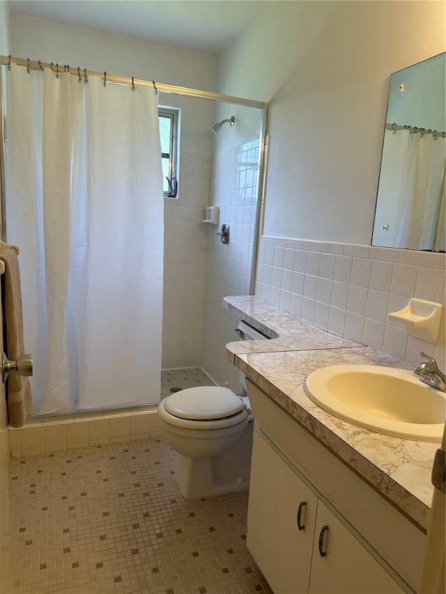 bathroom with tile patterned flooring, tasteful backsplash, walk in shower, vanity, and toilet