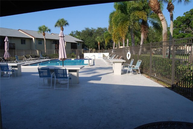 view of swimming pool with a patio area