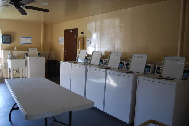 laundry area with washer and dryer, ceiling fan, and sink