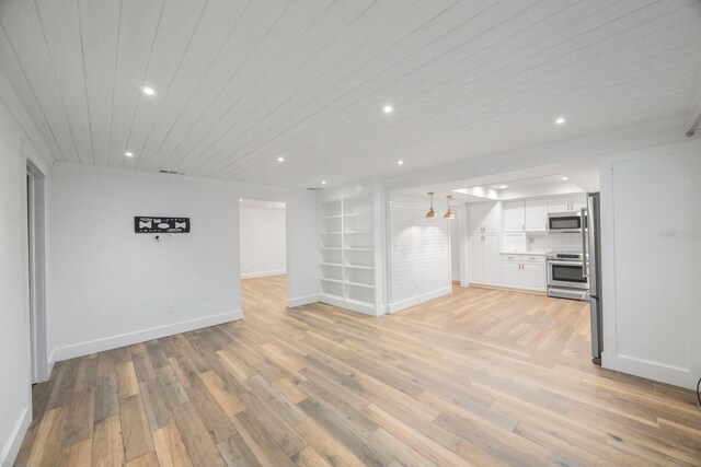 unfurnished living room featuring built in features, wooden ceiling, and light hardwood / wood-style flooring