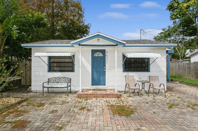 bungalow featuring a patio area