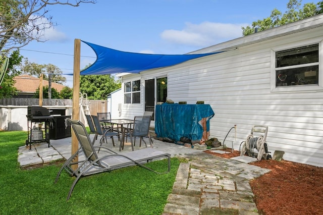 exterior space with a lawn and a patio