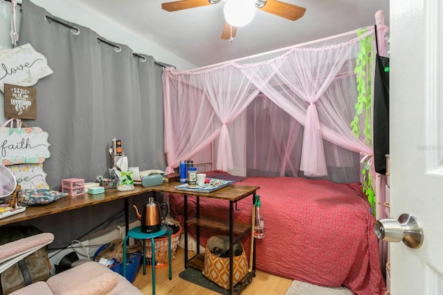 bedroom featuring light wood-type flooring and ceiling fan