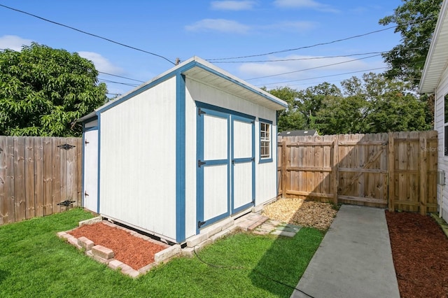 view of outdoor structure featuring a lawn