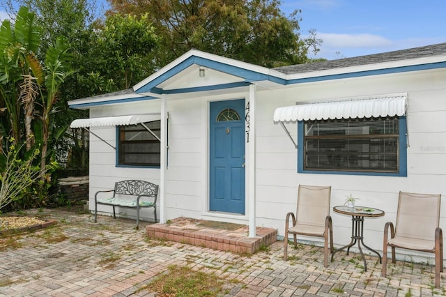 entrance to property featuring a patio area