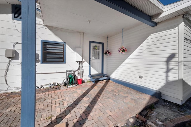 property entrance with a patio area