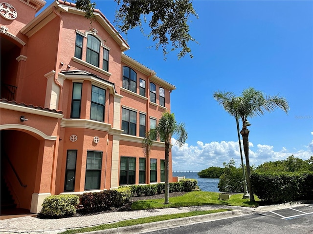 view of building exterior with a water view