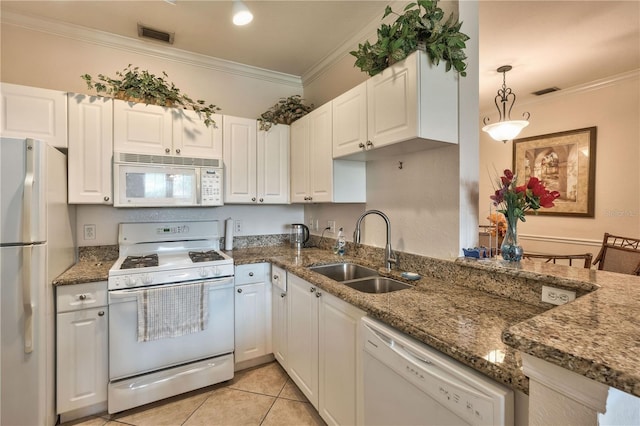 kitchen featuring ornamental molding, stone countertops, sink, and white appliances