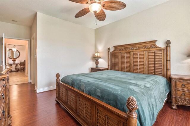 bedroom featuring ceiling fan and dark hardwood / wood-style flooring